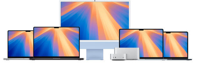 a group of computer monitors and laptops are lined up on a black background